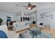 Spacious living room with wood floors, stylish furniture, and an open layout at 1754 Pennecamp Dr, The Villages, FL 32162
