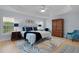 Comfortable main bedroom featuring tray ceilings, wood floors, and a stylish area rug at 1754 Pennecamp Dr, The Villages, FL 32162