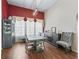 Formal dining room with hardwood floors, natural lighting, and gray dining set at 17787 Se 114Th Ave, Summerfield, FL 34491