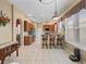 Open kitchen with breakfast bar, oak cabinets, stainless appliances, and recessed lighting at 17787 Se 114Th Ave, Summerfield, FL 34491
