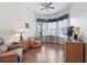 Bright living area with many windows and a ceiling fan at 17787 Se 114Th Ave, Summerfield, FL 34491