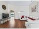 Spacious living room featuring modern decor, hardwood floors, and natural light at 17787 Se 114Th Ave, Summerfield, FL 34491