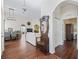 Open living area with hardwood floors and traditional-style decor and furnishings at 17787 Se 114Th Ave, Summerfield, FL 34491