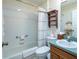 Bathroom features a tub, a shower, a toilet, and vanity with a sink at 1806 Estafana Way, The Villages, FL 32159