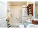 Bathroom features a tub, a shower, a toilet, and a vanity with a sink at 1806 Estafana Way, The Villages, FL 32159
