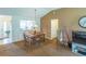 Bright dining area featuring a wooden table set and view to the kitchen at 1806 Estafana Way, The Villages, FL 32159