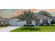 Charming single-story home with a well-manicured lawn and inviting front entrance at 1806 Estafana Way, The Villages, FL 32159