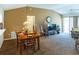 Open-concept living area with dining space and access to the outdoors at 1806 Estafana Way, The Villages, FL 32159