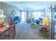 Cozy living room with comfortable seating, a dining area, and access to the outdoors at 1806 Estafana Way, The Villages, FL 32159