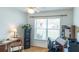 Bright office space with a large window that offers neighborhood views and hardwood floors at 1806 Estafana Way, The Villages, FL 32159