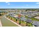 Spacious single-Gathering home in a serene neighborhood, surrounded by lush landscaping and a tranquil lake at 2001 Dagenais Way, The Villages, FL 32163