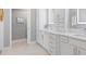Modern bathroom features a double vanity, custom cabinetry, and lots of counter space at 2001 Dagenais Way, The Villages, FL 32163