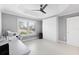 Versatile bedroom with a built-in Murphy bed, desk, large windows, and neutral color palette at 2001 Dagenais Way, The Villages, FL 32163