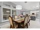 An elegant dining room features a chandelier and custom window shutters at 2001 Dagenais Way, The Villages, FL 32163