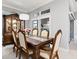 Formal dining room with a classic wooden table, upholstered chairs, and a chandelier for elegant dining at 2001 Dagenais Way, The Villages, FL 32163