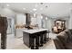 Beautiful kitchen with a large center island, pendant lighting, modern appliances, and plenty of cabinet space at 2001 Dagenais Way, The Villages, FL 32163