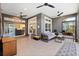 Comfortable living area featuring a gray interior, tile floors, and ceiling fans for relaxed, stylish living at 2001 Dagenais Way, The Villages, FL 32163