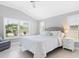Relax in the comfortable main bedroom with plenty of natural light at 2001 Dagenais Way, The Villages, FL 32163