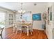 Traditional dining room featuring a wood table with seating for four under an elegant chandelier fixture at 2063 Thornton Ter, The Villages, FL 32162
