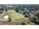 Aerial view of the home highlighting its location on a golf course and the surrounding community at 2126 Burley Ave, Clermont, FL 34711