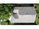 Overhead aerial view of the home's roof and surrounding mature trees and landscaping at 2126 Burley Ave, Clermont, FL 34711