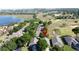 An aerial view showcasing the property's location near a lake and golf course at 2126 Burley Ave, Clermont, FL 34711