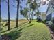 Spacious backyard featuring lush green lawn and tranquil natural scenery at 2126 Burley Ave, Clermont, FL 34711
