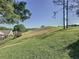 Expansive backyard with gently sloping lawn and views of green space at 2126 Burley Ave, Clermont, FL 34711