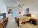 Bedroom featuring wood furnishings, a ceiling fan and a window with blinds at 2126 Burley Ave, Clermont, FL 34711
