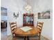 Dining area featuring a round table, cabinet and chandelier at 2126 Burley Ave, Clermont, FL 34711