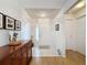 Inviting foyer with a decorative table and tiled flooring at 2126 Burley Ave, Clermont, FL 34711