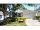 Charming single-story home featuring a well-manicured lawn and a two-car garage at 2126 Burley Ave, Clermont, FL 34711