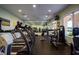Community gym with treadmills, weights, mirror, and mounted television at 2126 Burley Ave, Clermont, FL 34711