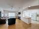Bright living room offering a view of the kitchen area and comfortable sofas at 2126 Burley Ave, Clermont, FL 34711