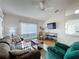 Inviting living room featuring bright light, a TV, and comfortable seating at 2126 Burley Ave, Clermont, FL 34711