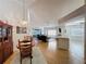 Bright living room featuring wood floors, chandelier, and views of an open space at 2126 Burley Ave, Clermont, FL 34711