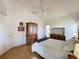 Spacious main bedroom featuring wood floors, vaulted ceilings, and ensuite bathroom access at 2126 Burley Ave, Clermont, FL 34711
