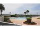 Community pool with lounge chairs and lush landscaping overlooking the area at 2126 Burley Ave, Clermont, FL 34711