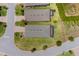 Aerial view of a backyard and homesite with lush green lawn and landscaping at 2129 Palm Tree Dr, Poinciana, FL 34759