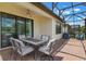 Covered patio with ceiling fan, and outdoor dining set at 2129 Palm Tree Dr, Poinciana, FL 34759