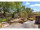 Backyard garden area with raised planter beds and mature landscaping at 2252 Kent Rd, Deltona, FL 32738
