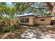 Backyard of yellow home featuring mature trees providing ample shade at 2252 Kent Rd, Deltona, FL 32738
