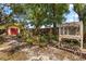 Lush backyard garden with potting area, mature trees and shed at 2252 Kent Rd, Deltona, FL 32738