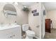 Well-lit bathroom with a white vanity and mirrored medicine cabinet at 2252 Kent Rd, Deltona, FL 32738