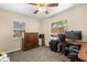 Bedroom with neutral walls and ceiling fan, featuring a corner workspace at 2252 Kent Rd, Deltona, FL 32738