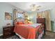 Cozy bedroom with colorful accents, unique artwork, and ceiling fan at 2252 Kent Rd, Deltona, FL 32738