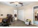 Bedroom with view of office and closet, featuring a ceiling fan at 2252 Kent Rd, Deltona, FL 32738