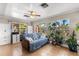 Bright living room with tile floors, large windows, and plant display at 2252 Kent Rd, Deltona, FL 32738