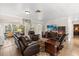 Spacious living room featuring leather seating, a media center, and a cozy rug at 2252 Kent Rd, Deltona, FL 32738