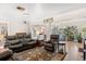 Comfortable living room with cozy seating, a large window, and plant decor, offering a relaxing space at 2252 Kent Rd, Deltona, FL 32738